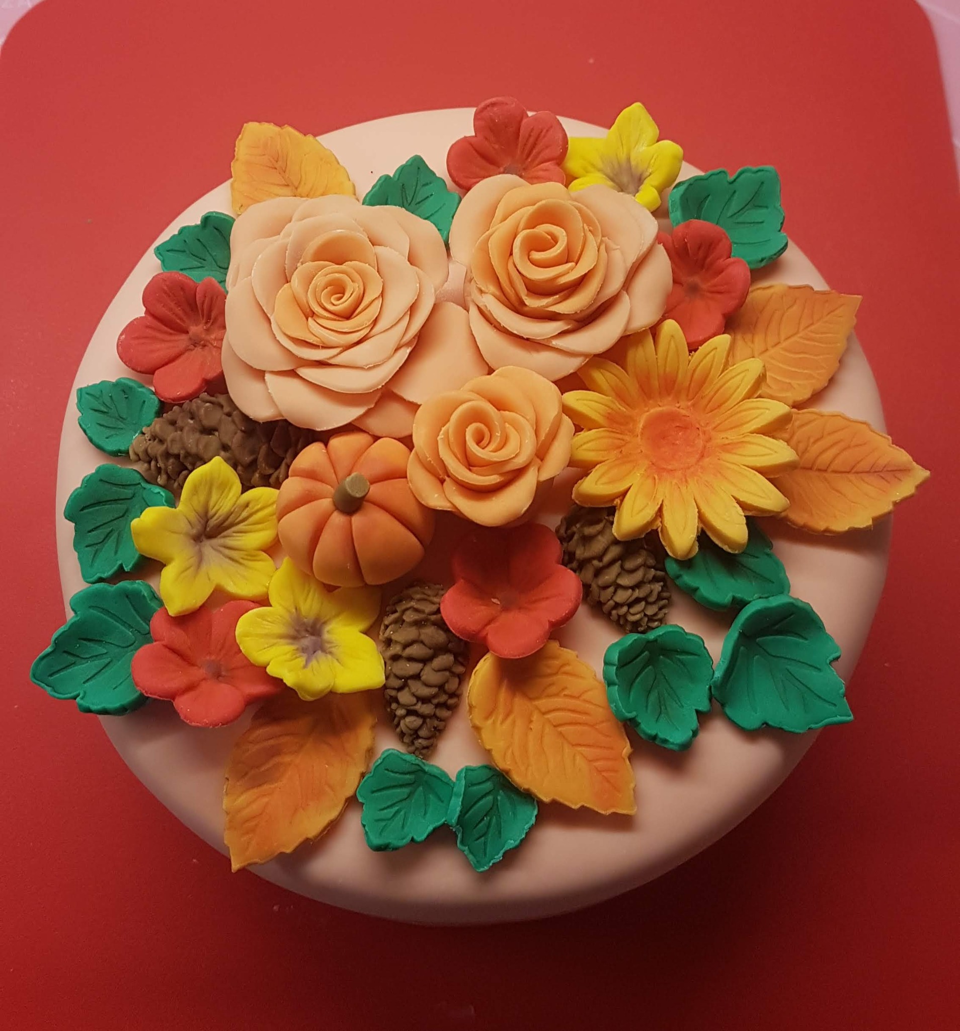 Bespoke celebration cake with handmade flowers