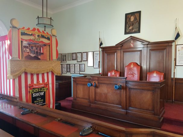 Punch and Judy set up in the council chamber