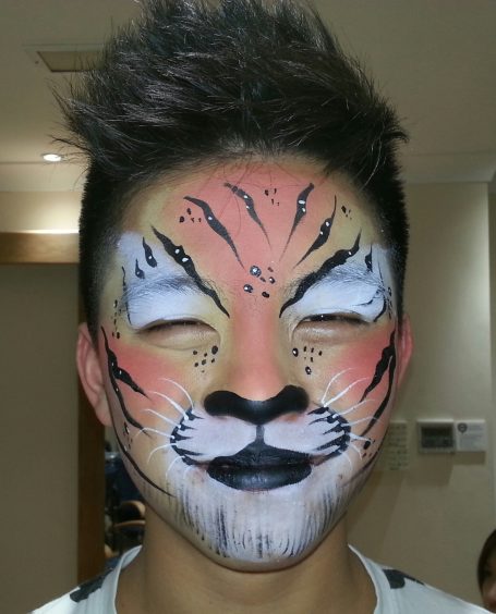 Tiger face painted by Hazel