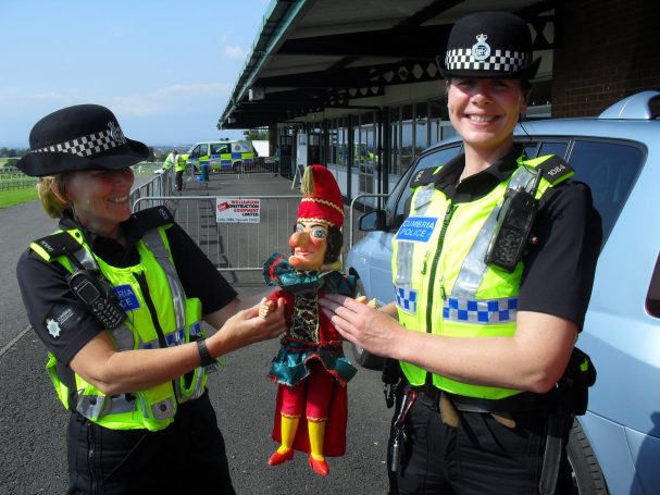 Mr Punch with police officers