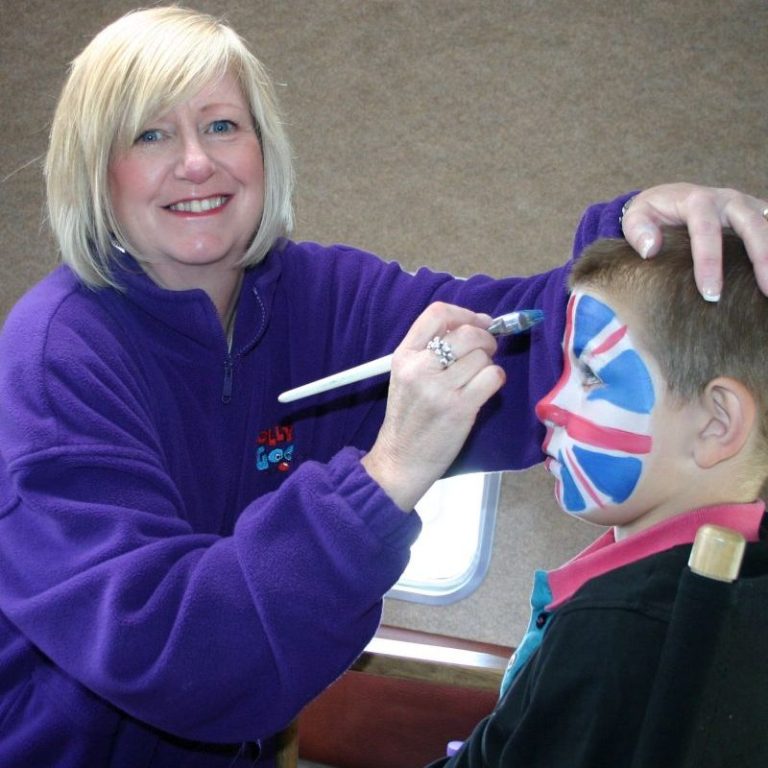 Hazel face painting at an event