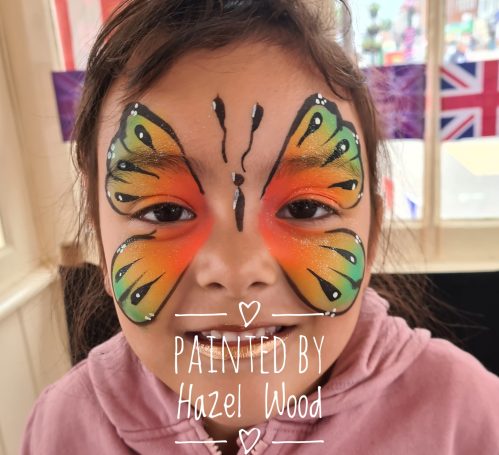 Butterfly face painted by Hazel