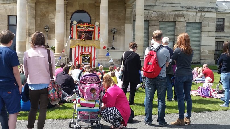 Families watching the Punch and Judy Show