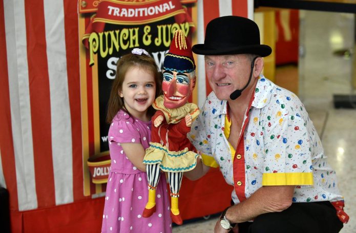 Little girl holding Mr punch