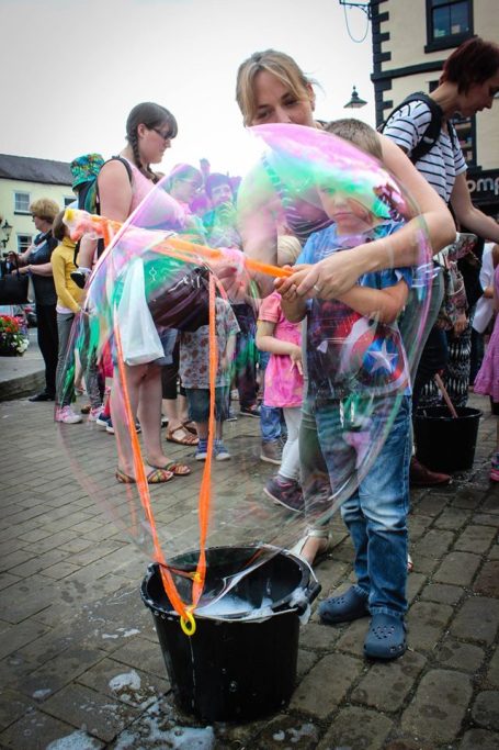 Mum helps make a bubble